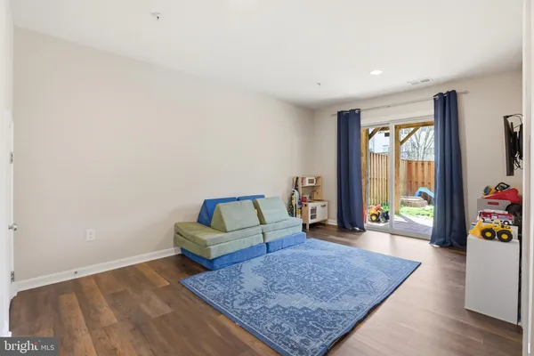 a view of a backyard with table and chairs