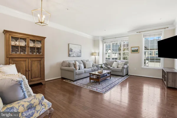 a living room with furniture or couch and a flat screen tv