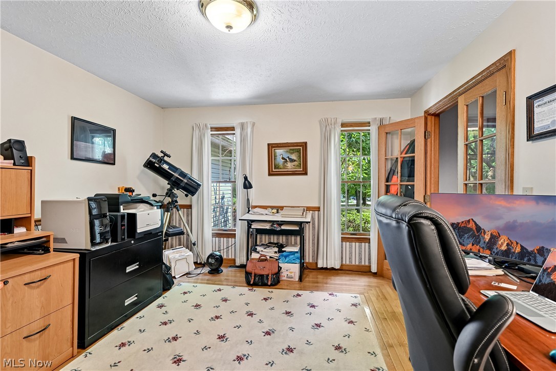 2660 South Medina Line Road Wadsworth, OH 44281 - Photo 11 of 48 Dining room is currently being used as an office with french doors, carpet and hardwood flooring