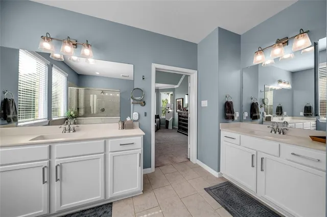 a bathroom with a sink vanity and a mirror