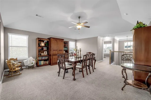 a view of a livingroom with furniture and a window