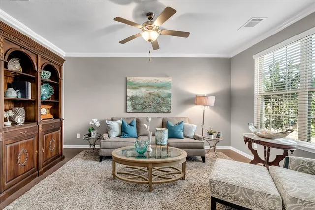 a living room with furniture and a window