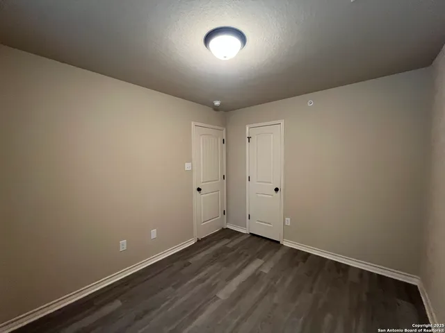 a white bath tub sitting next to a white toilet and sink