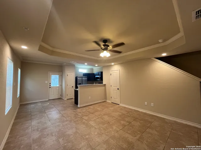 a view of a livingroom with a kitchen
