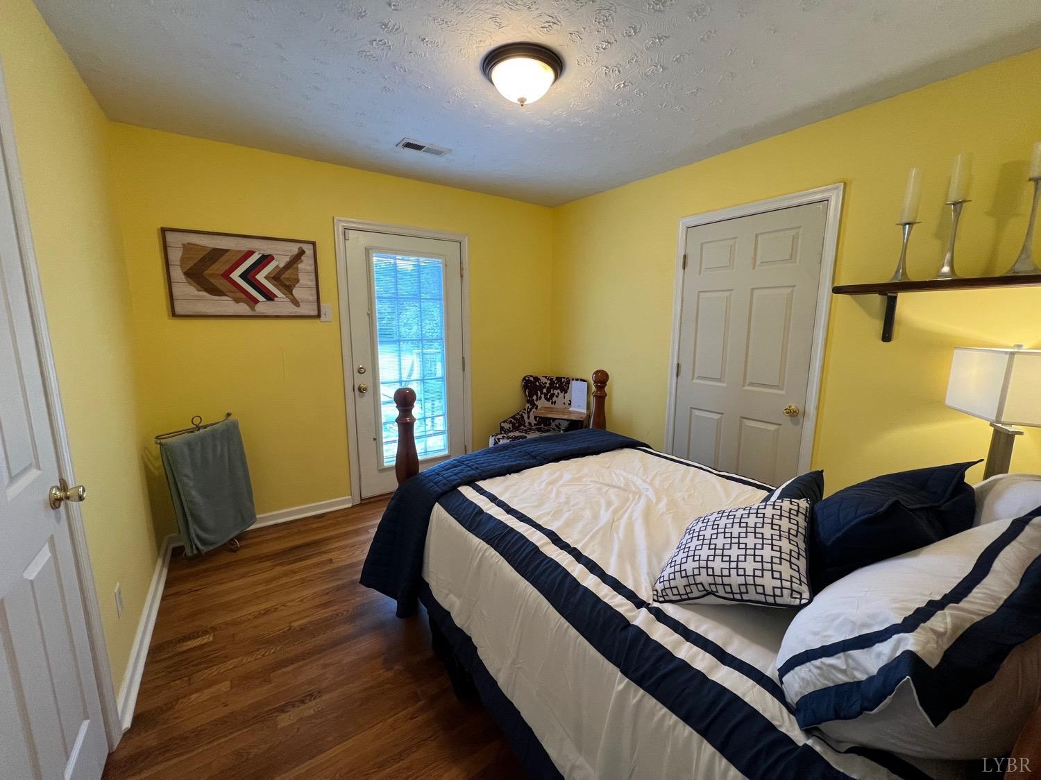 857 Woodson Road Roseland, VA 22967 - Photo 13 of 31 a bed sitting in a bedroom next to a window