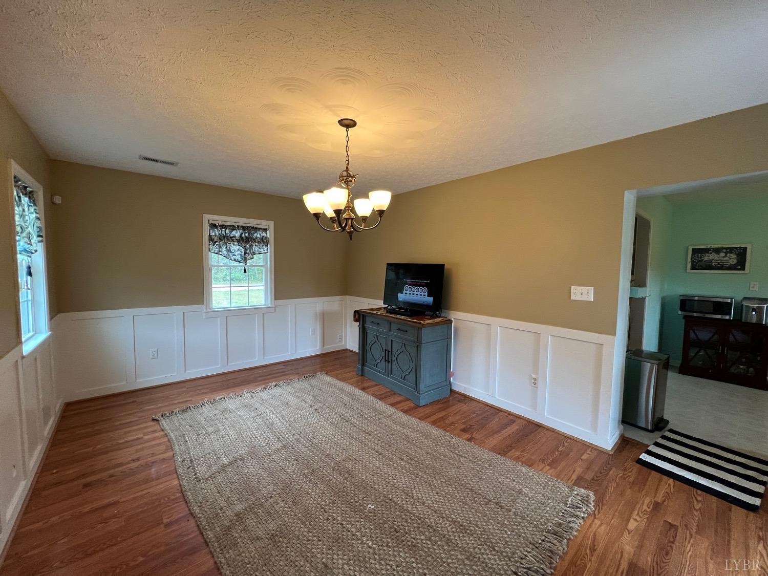857 Woodson Road Roseland, VA 22967 - Photo 15 of 31 a view of a livingroom with a chandelier