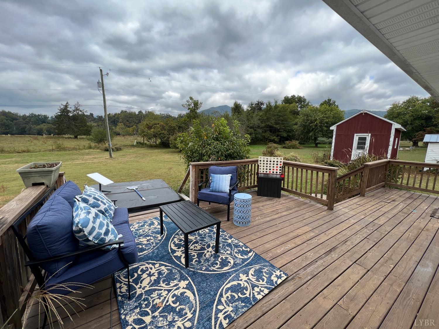 857 Woodson Road Roseland, VA 22967 - Photo 18 of 31 a view of a roof deck with couches