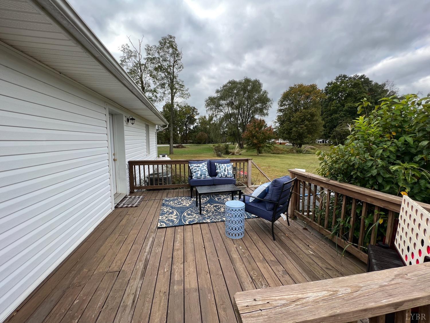 857 Woodson Road Roseland, VA 22967 - Photo 19 of 31 a view of deck with seating space and trees