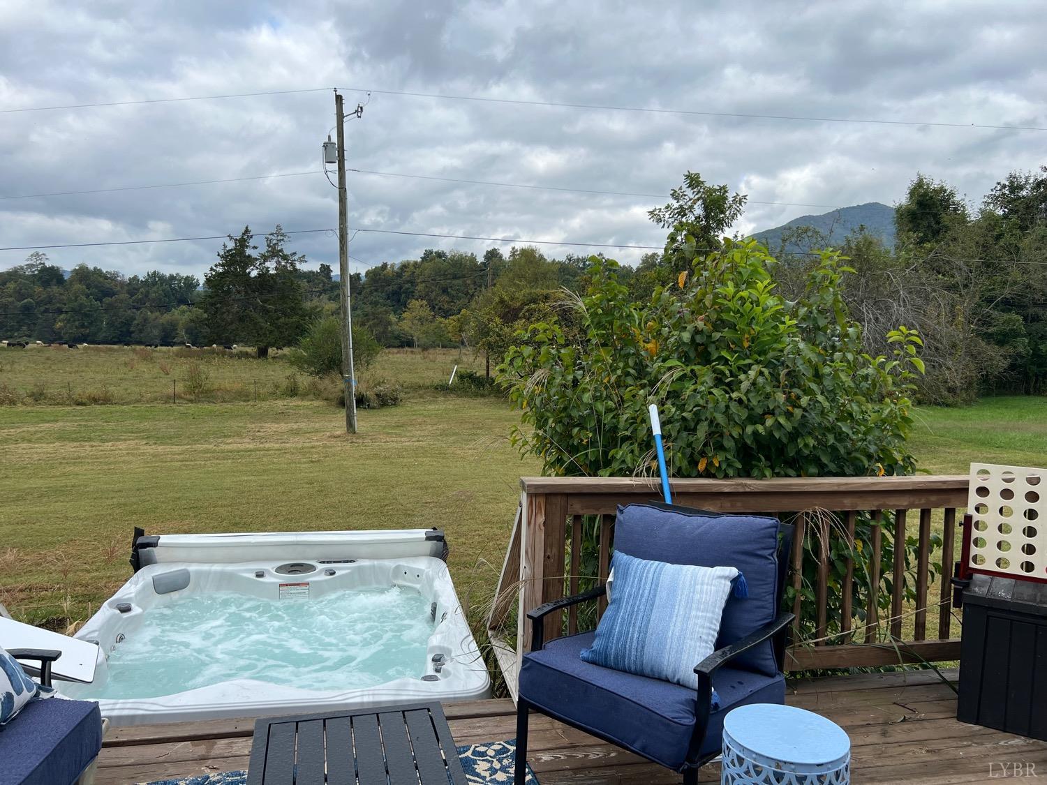 857 Woodson Road Roseland, VA 22967 - Photo 22 of 31 a view of a balcony with chair and wooden floor