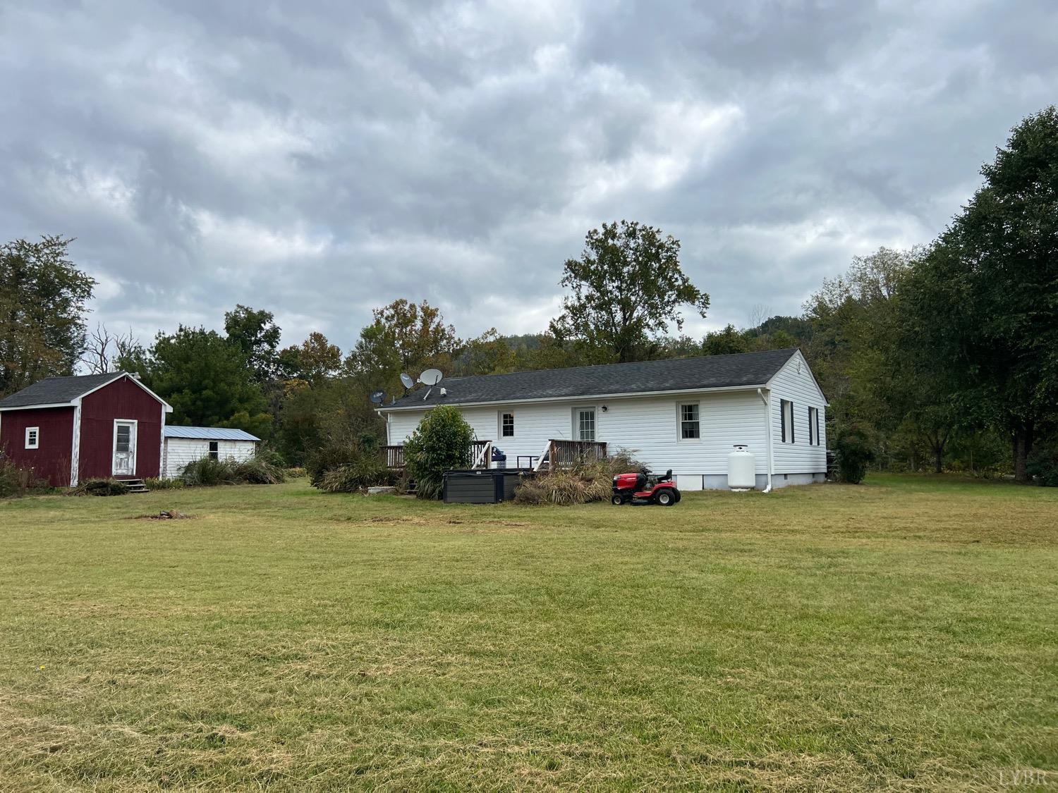 857 Woodson Road Roseland, VA 22967 - Photo 25 of 31 a view of a house with a yard and sitting area