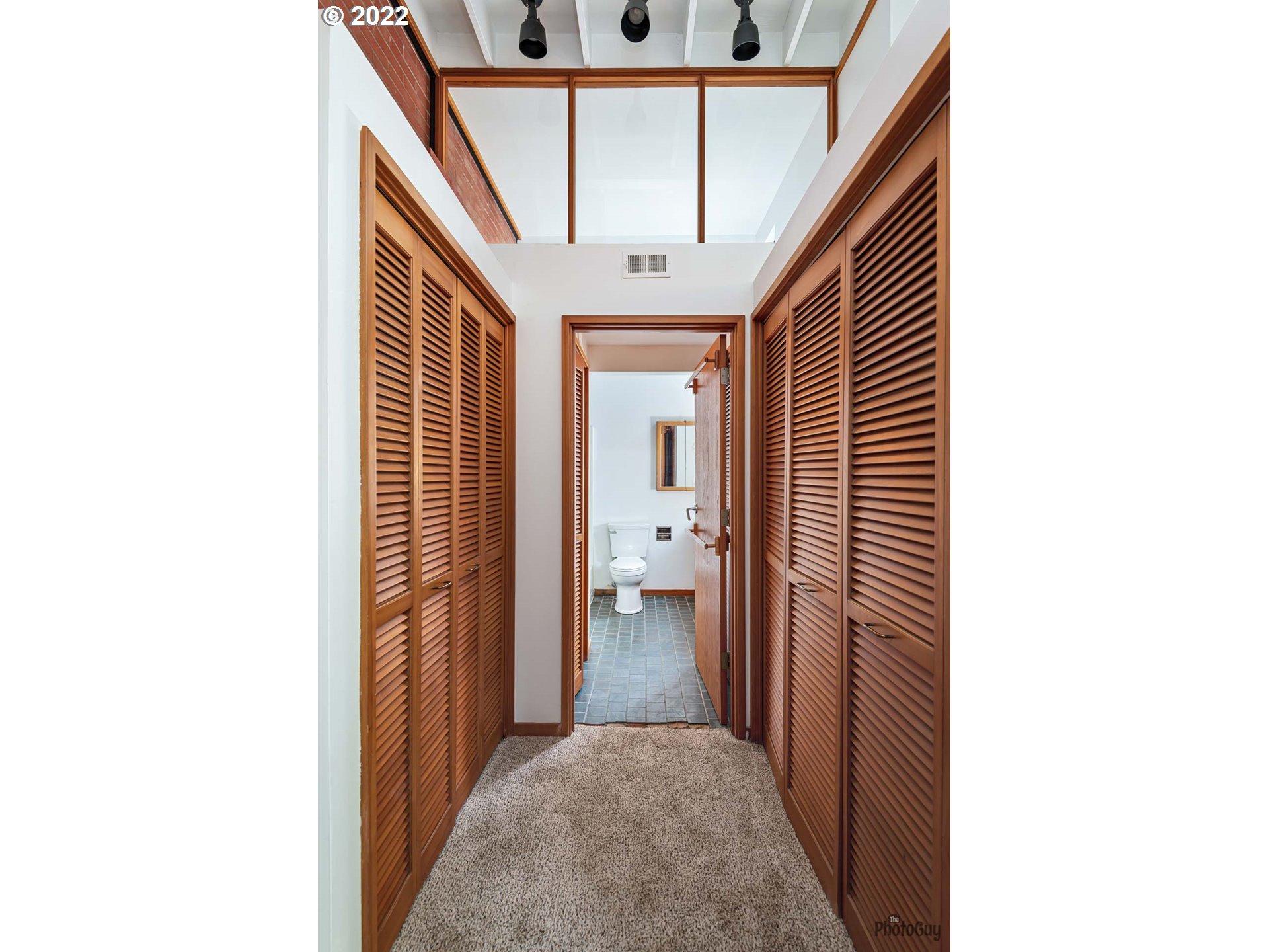 110 High Street Eugene, OR 97401 - Photo 16 of 25 a view of a hallway with wooden floor and staircase