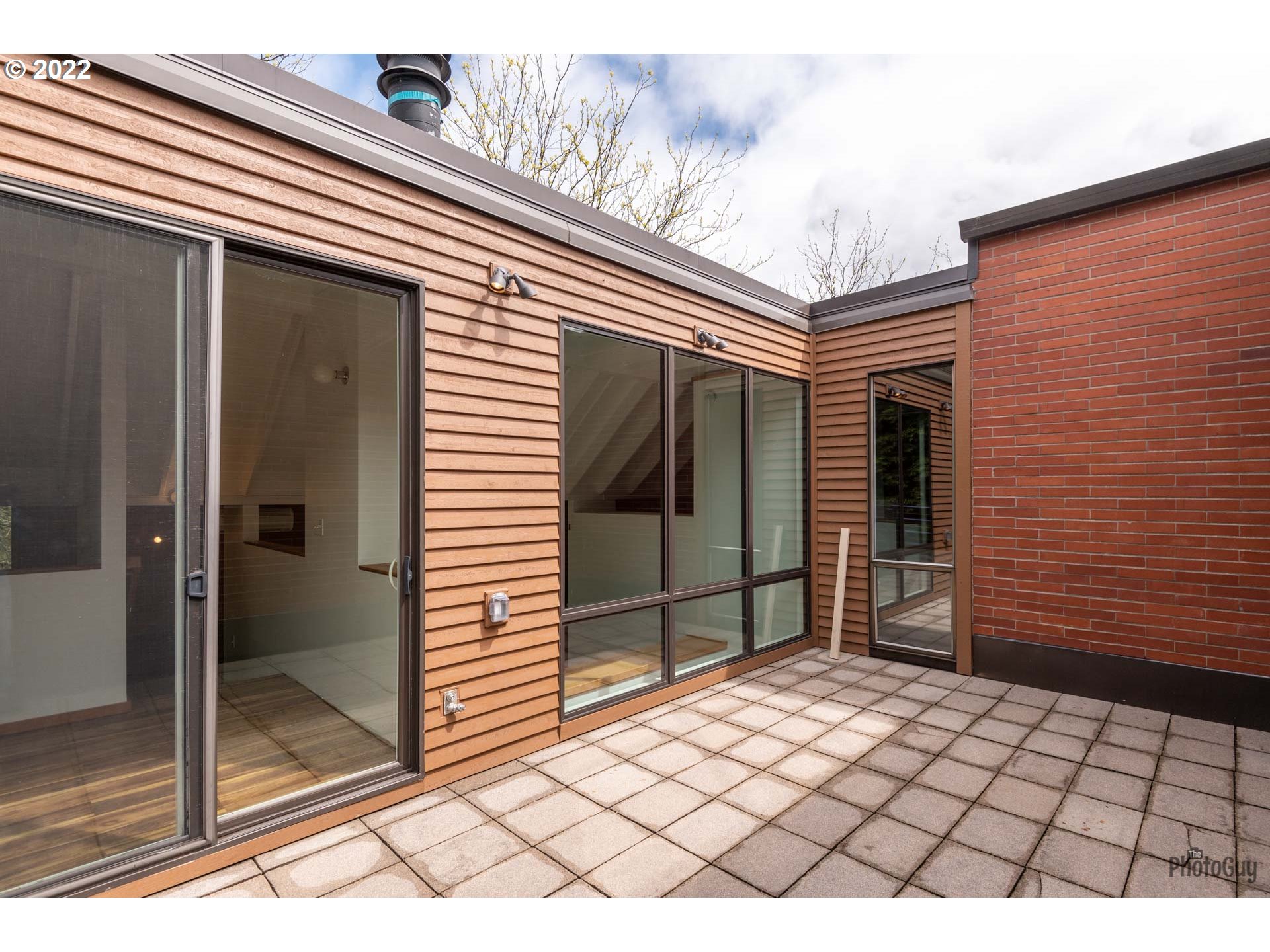 110 High Street Eugene, OR 97401 - Photo 24 of 25 a potted plant sitting in front of a door