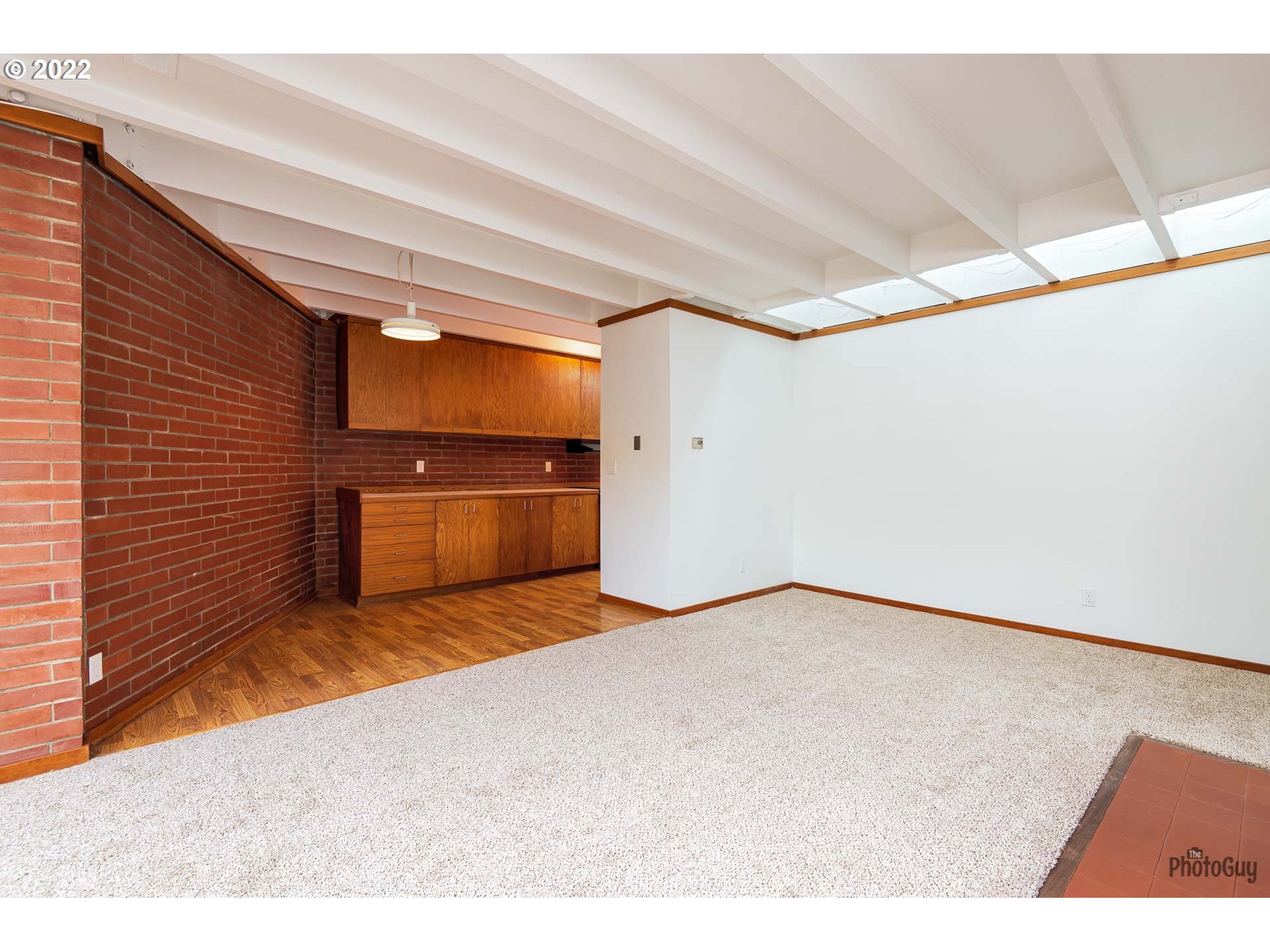 110 High Street Eugene, OR 97401 - Photo 4 of 25 a view of an empty room with a fireplace
