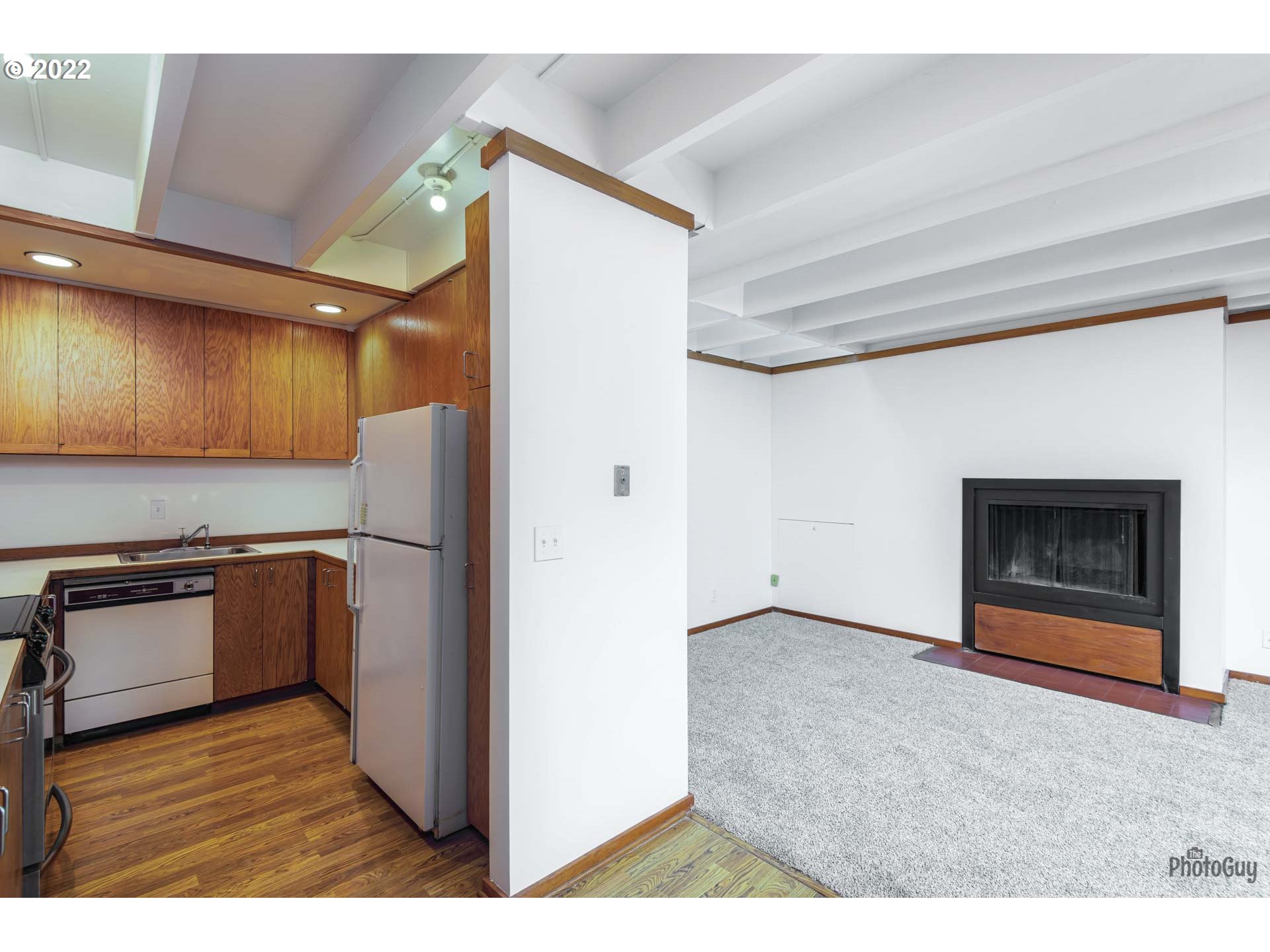110 High Street Eugene, OR 97401 - Photo 9 of 25 a kitchen with stainless steel appliances granite countertop a refrigerator and a stove top oven