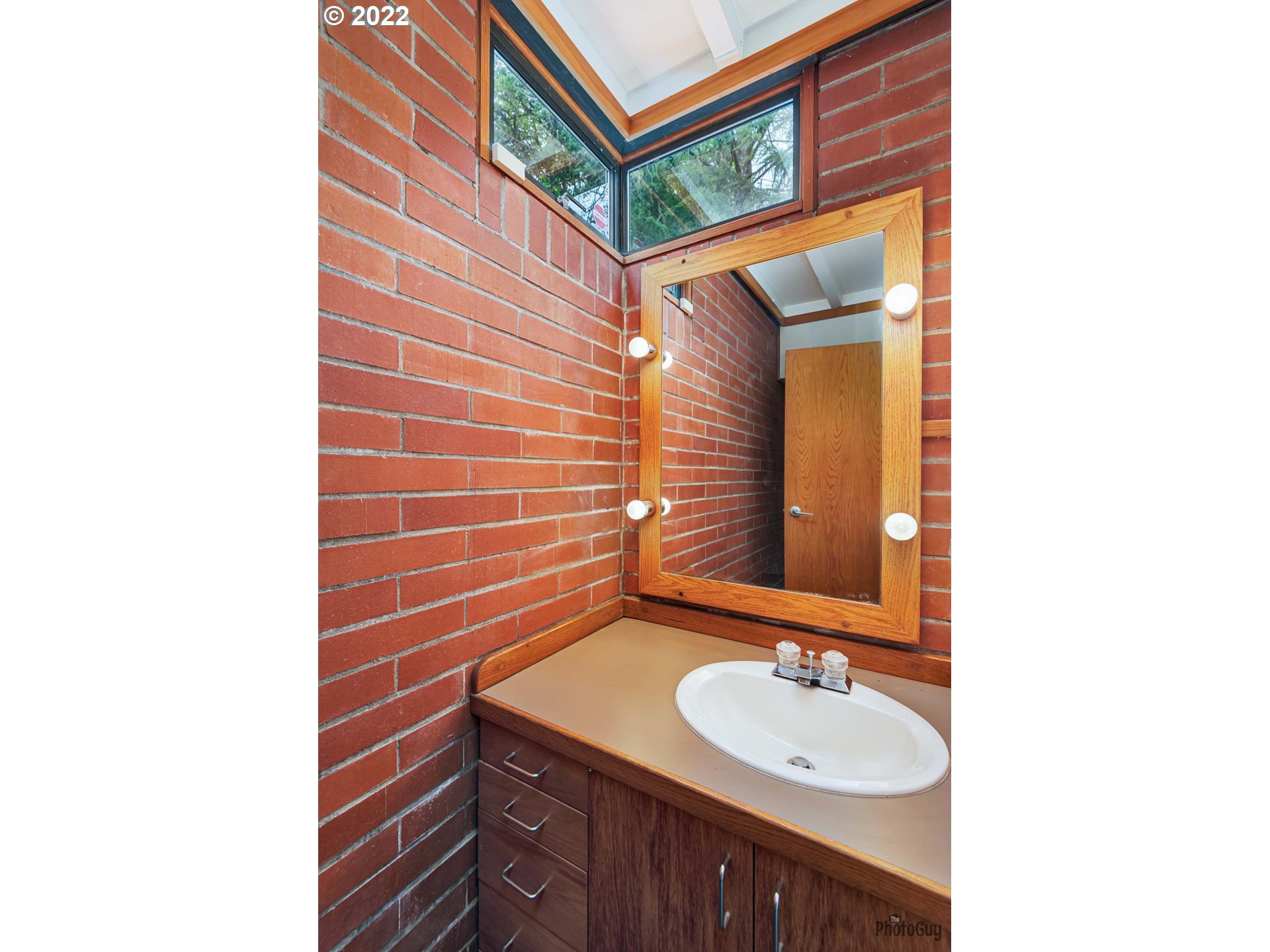 110 High Street Eugene, OR 97401 - Photo 10 of 25 a bathroom with a sink and a mirror