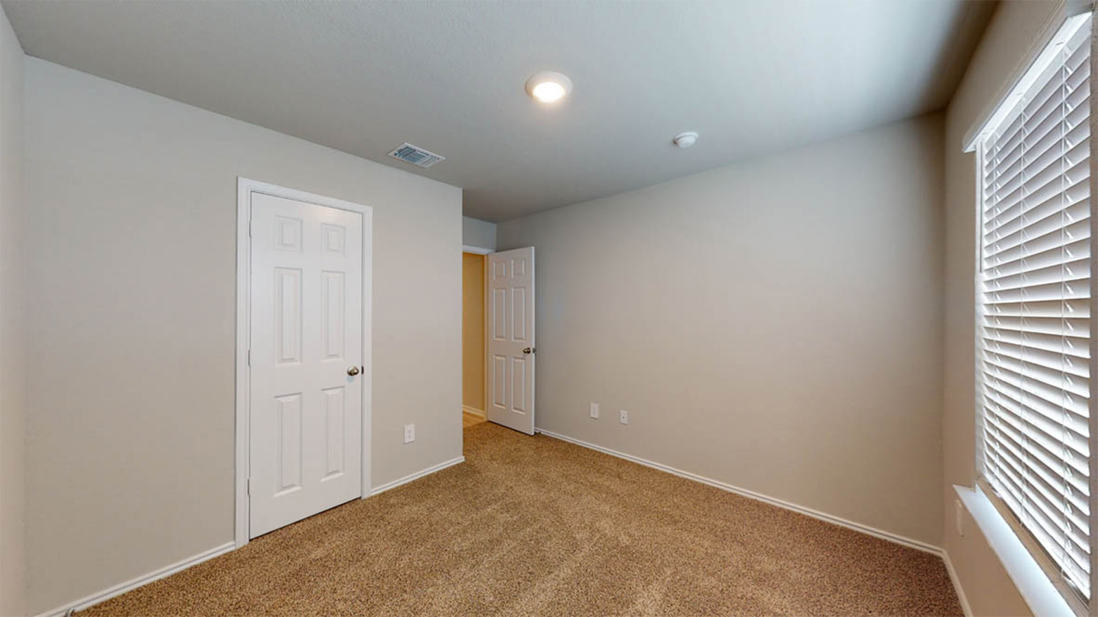 1417 Victory Rnch Trail Killeen, TX 76549 - Photo 14 of 22 A well-lit room featuring neutral walls, plush carpet, and natural illumination from the window.