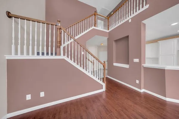 a view of an entryway with wooden floor