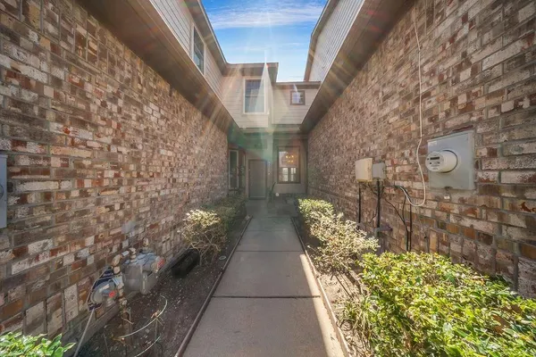a view of entryway with brick walls