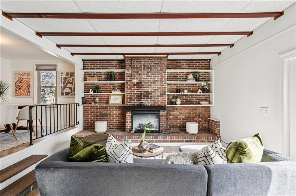 2226 Whites Mill Road Decatur, GA 30032 - Photo 12 of 51 a living room with furniture and a fireplace