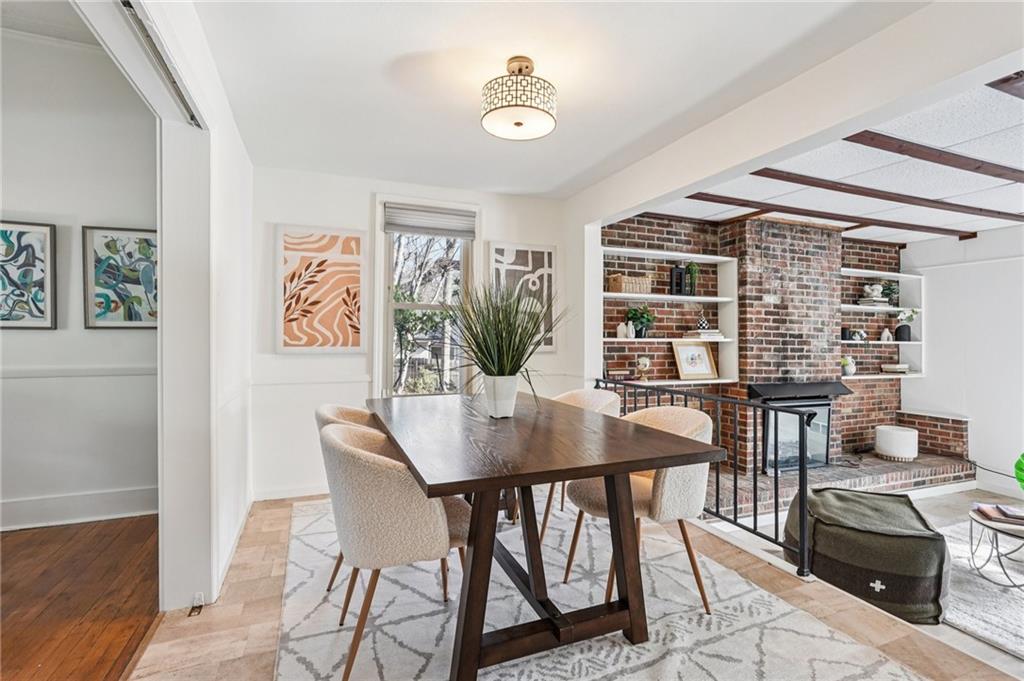 2226 Whites Mill Road Decatur, GA 30032 - Photo 14 of 51 a view of a dining room with furniture and wooden floor