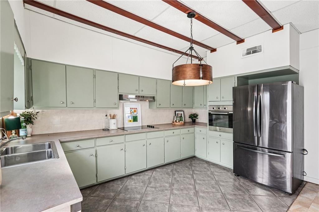 2226 Whites Mill Road Decatur, GA 30032 - Photo 15 of 51 a kitchen with stainless steel appliances granite countertop a sink a stove a refrigerator and island