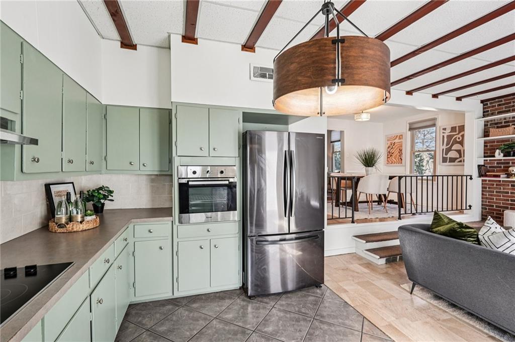 2226 Whites Mill Road Decatur, GA 30032 - Photo 17 of 51 a kitchen with stainless steel appliances granite countertop a refrigerator a sink a stove and a refrigerator