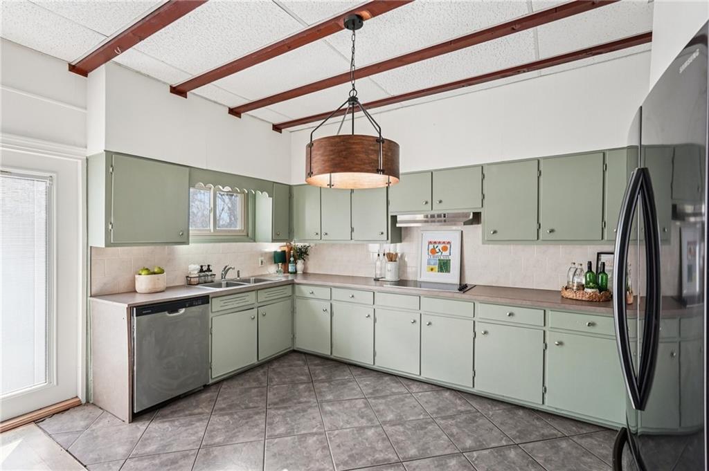 2226 Whites Mill Road Decatur, GA 30032 - Photo 18 of 51 a kitchen with a sink counter top space appliances and cabinets