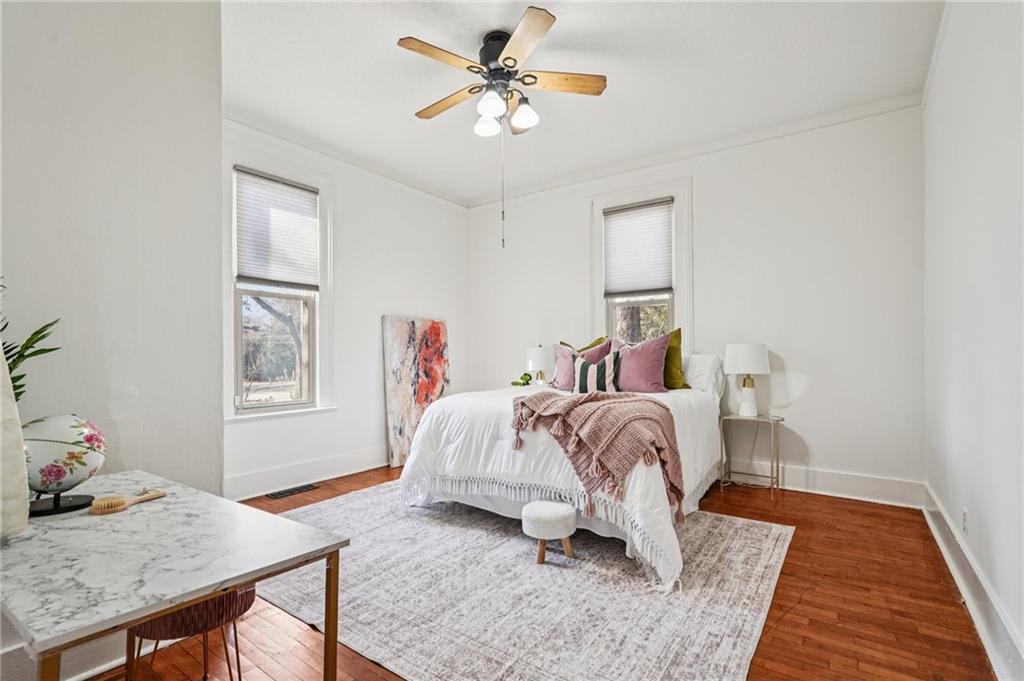 2226 Whites Mill Road Decatur, GA 30032 - Photo 20 of 51 a bedroom with a bed and wooden floor