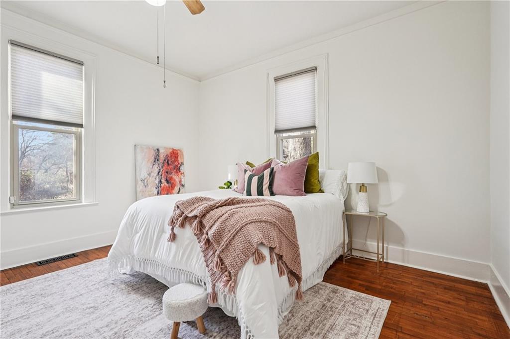 2226 Whites Mill Road Decatur, GA 30032 - Photo 21 of 51 a bed room with a bed and a painting on the wall