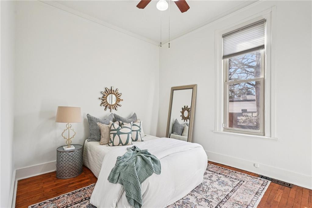2226 Whites Mill Road Decatur, GA 30032 - Photo 23 of 51 a bedroom with a bed and wooden floor