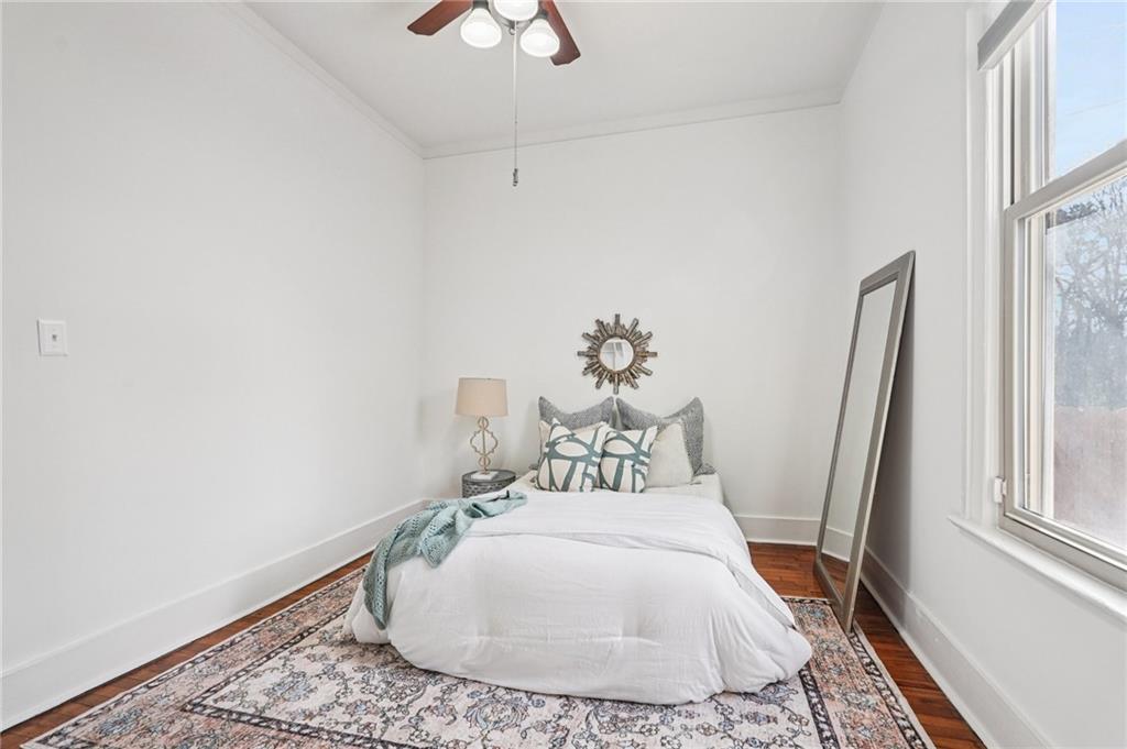 2226 Whites Mill Road Decatur, GA 30032 - Photo 24 of 51 a bedroom with a bed and wooden floor