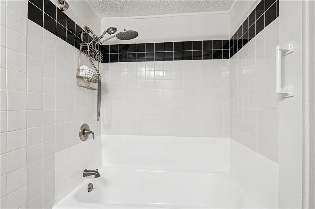 2226 Whites Mill Road Decatur, GA 30032 - Photo 27 of 51 a bathroom with a shower and a shower