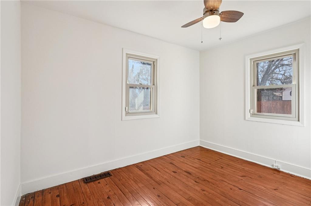 2226 Whites Mill Road Decatur, GA 30032 - Photo 28 of 51 a view of empty room with wooden floor and fan