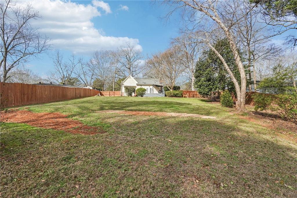 2226 Whites Mill Road Decatur, GA 30032 - Photo 36 of 51 a view of a field with large trees