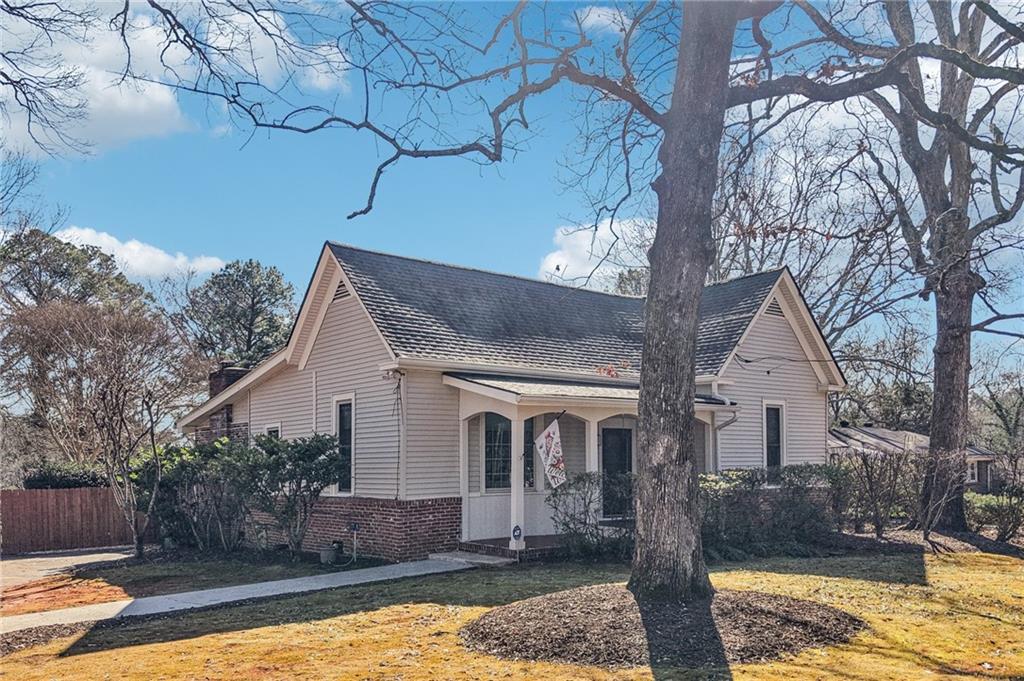 2226 Whites Mill Road Decatur, GA 30032 - Photo 39 of 51 a front view of a house with a yard garage and outdoor seating