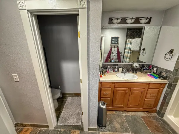 a kitchen with a refrigerator and a stove