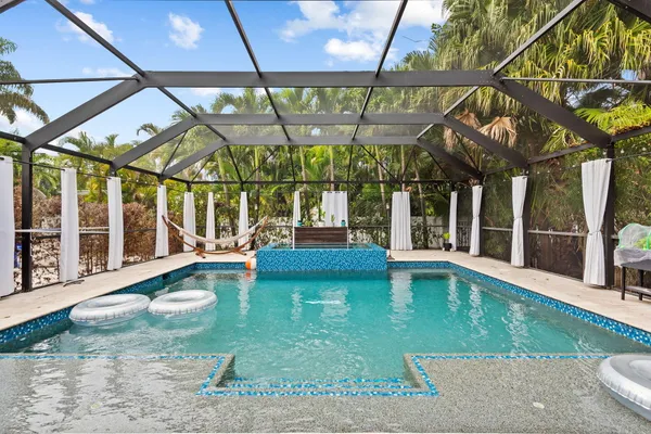 a view of swimming pool with a patio