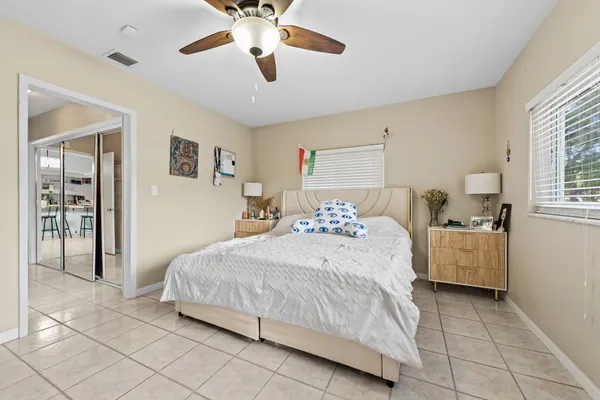 a bedroom with a bed and a dresser