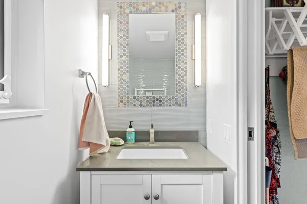 a view of a storage and utility room with washer and dryer
