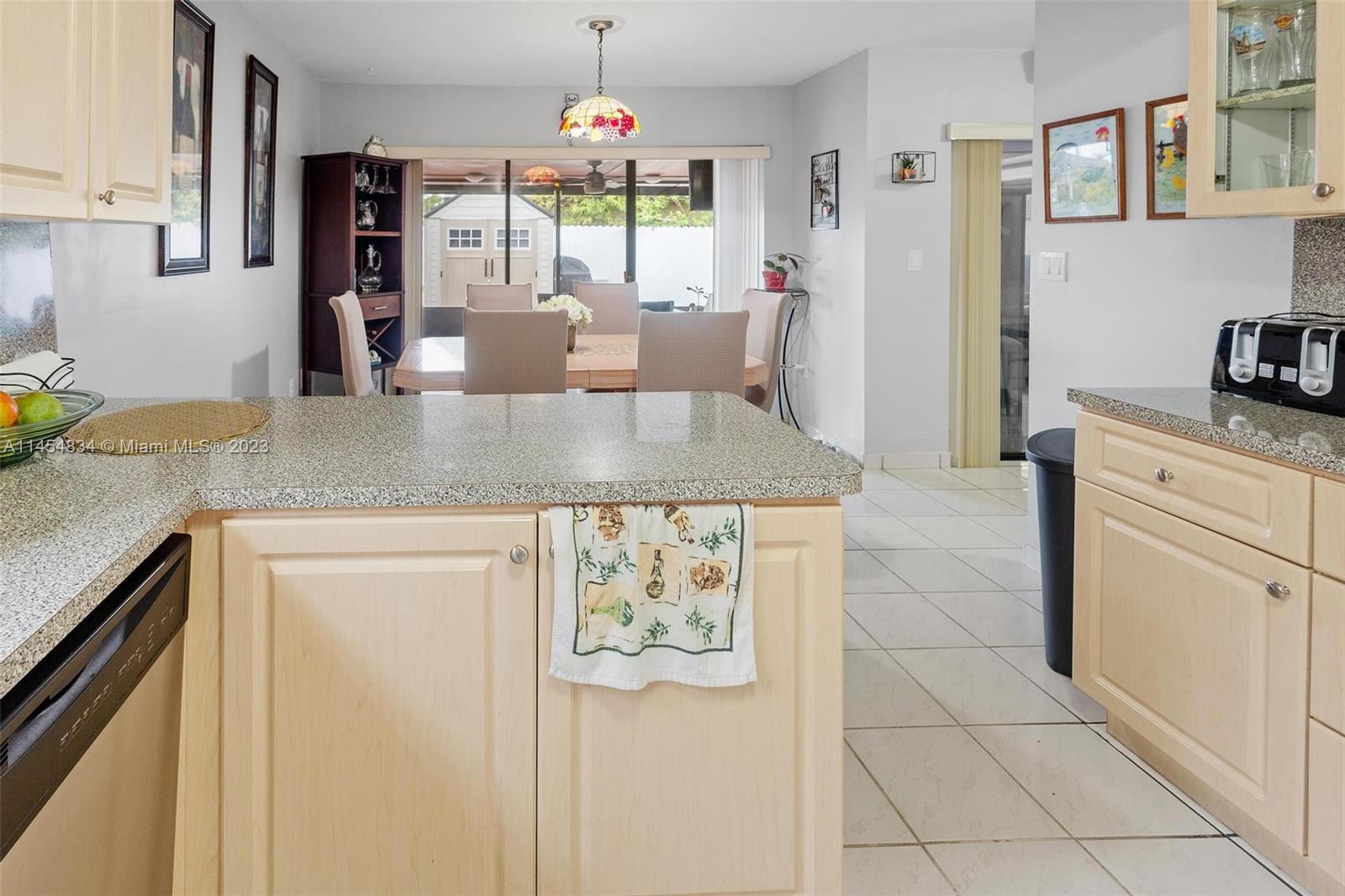 Tamiami Miami, FL 33182 - Photo 12 of 47 a kitchen with stainless steel appliances granite countertop a sink and a counter space