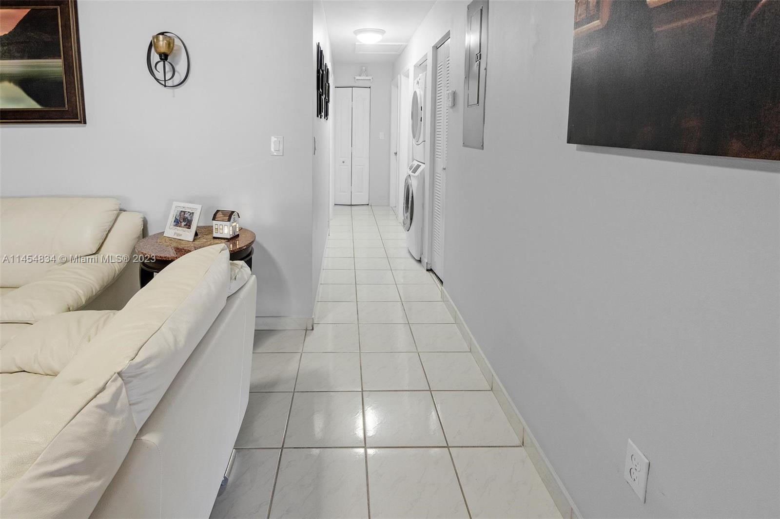 Tamiami Miami, FL 33182 - Photo 14 of 47 a hallway with a couch