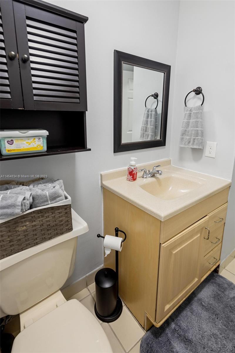 Tamiami Miami, FL 33182 - Photo 17 of 47 a bathroom with a sink and a mirror