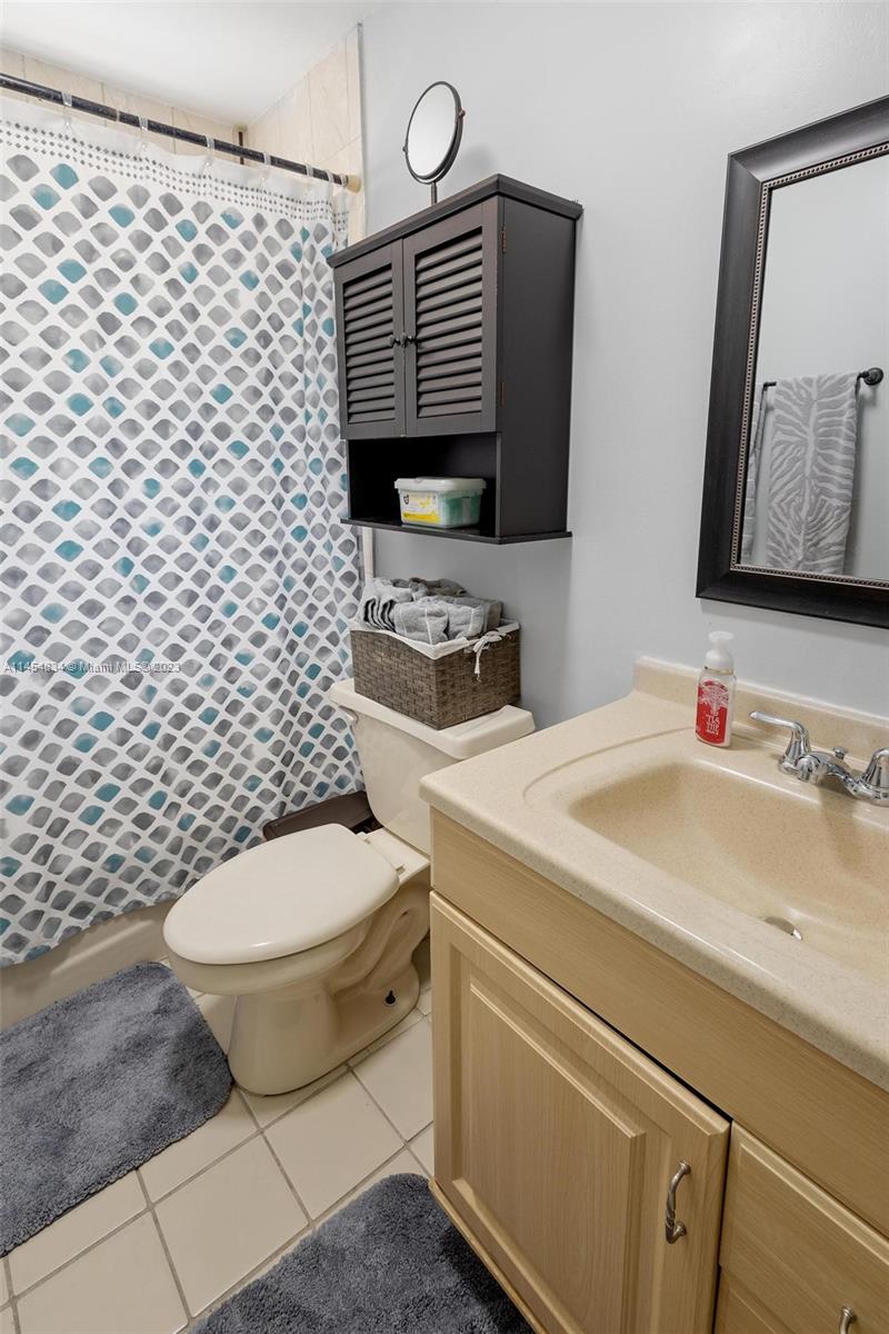 Tamiami Miami, FL 33182 - Photo 18 of 47 a bathroom with a sink toilet and mirror