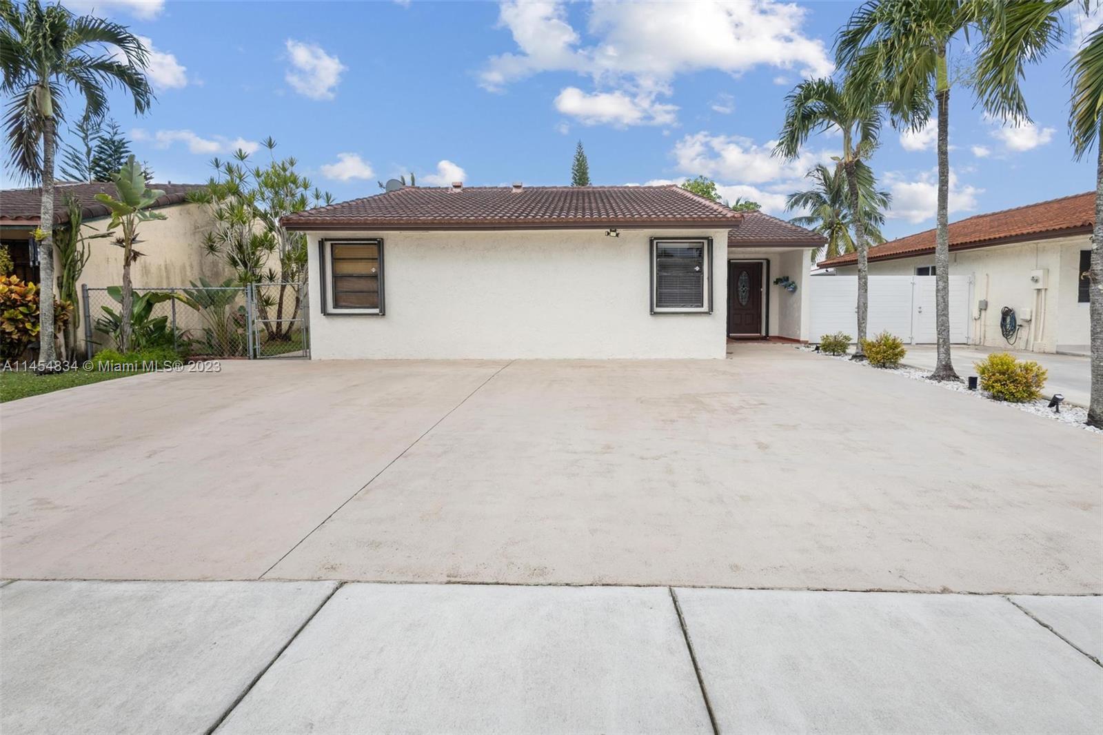 Tamiami Miami, FL 33182 - Photo 2 of 47 a view of a house with a outdoor space