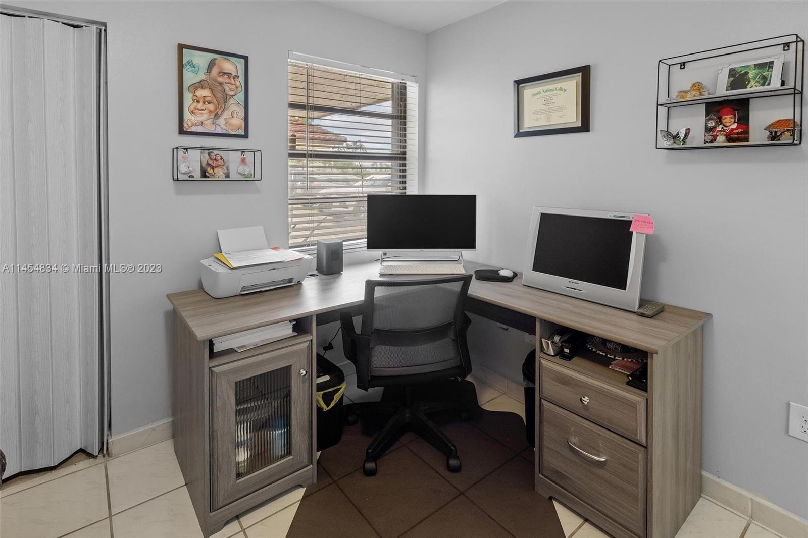 Tamiami Miami, FL 33182 - Photo 23 of 47 a view of a workspace with furniture and a window