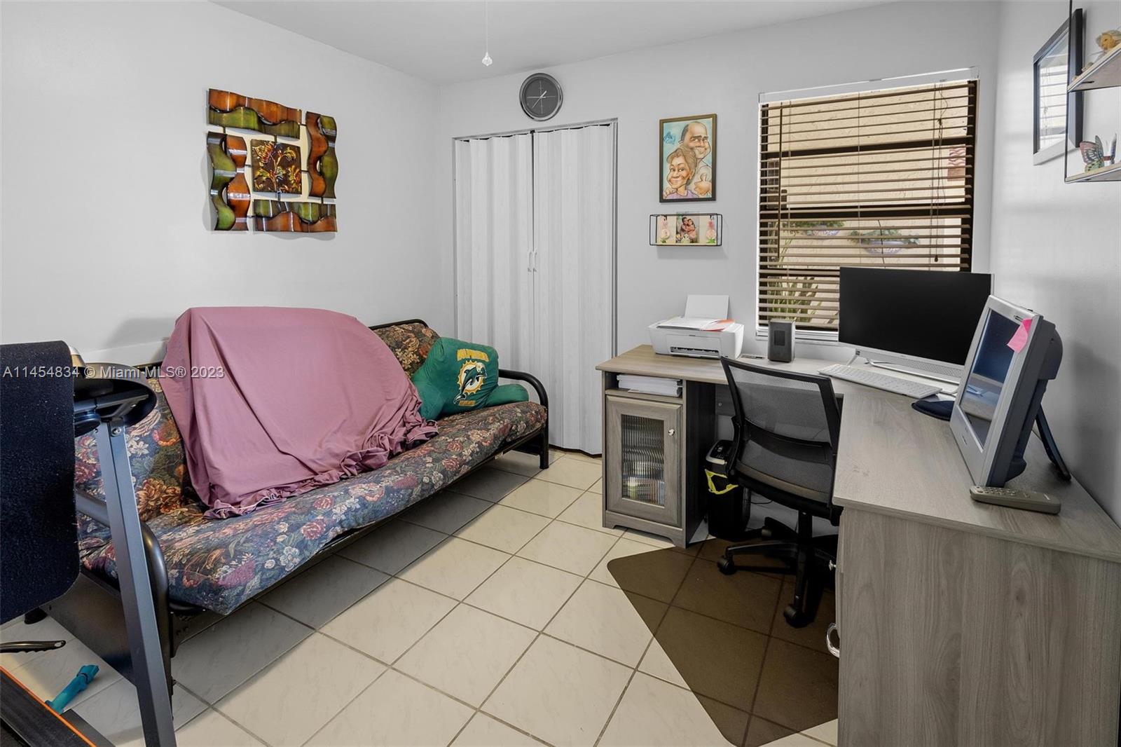 Tamiami Miami, FL 33182 - Photo 24 of 47 a bedroom with a bed and a desk