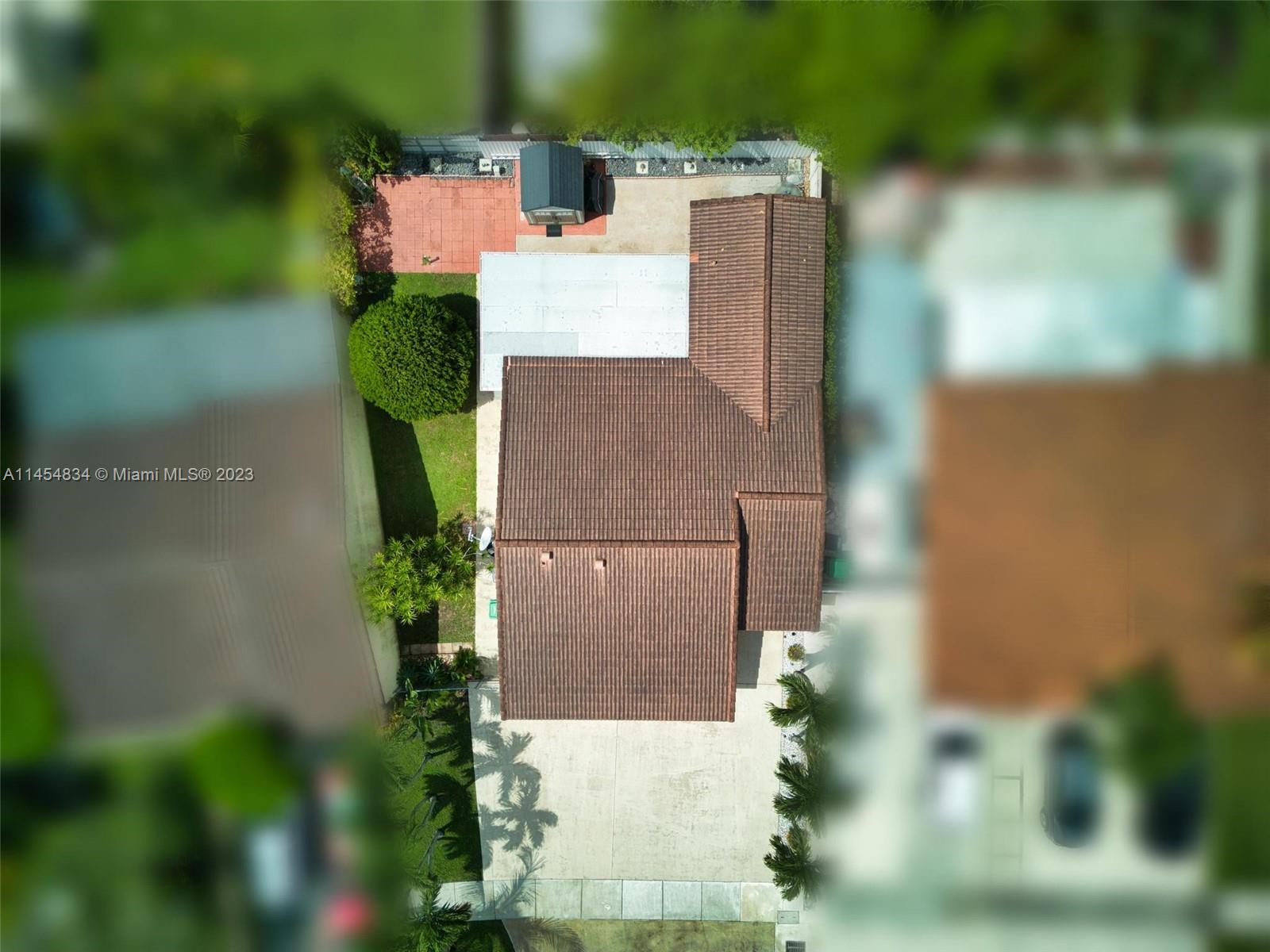 Tamiami Miami, FL 33182 - Photo 3 of 47 an aerial view of a house with a yard and garden