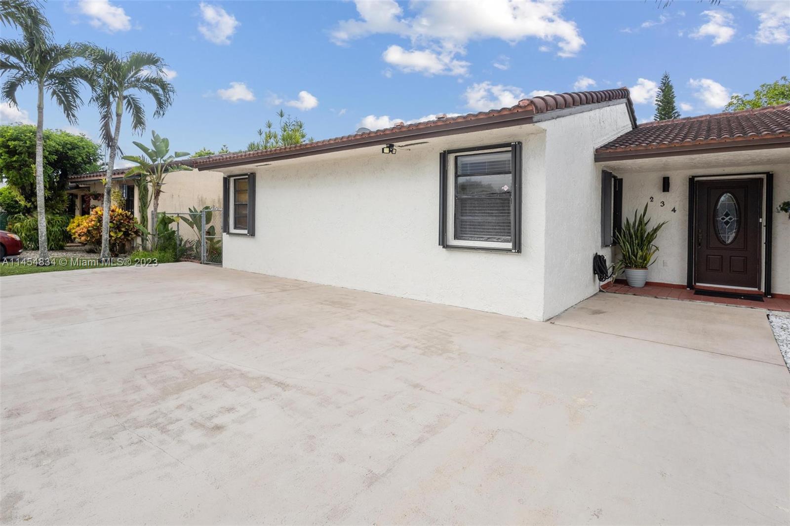 Tamiami Miami, FL 33182 - Photo 32 of 47 front view of a house with a outdoor space