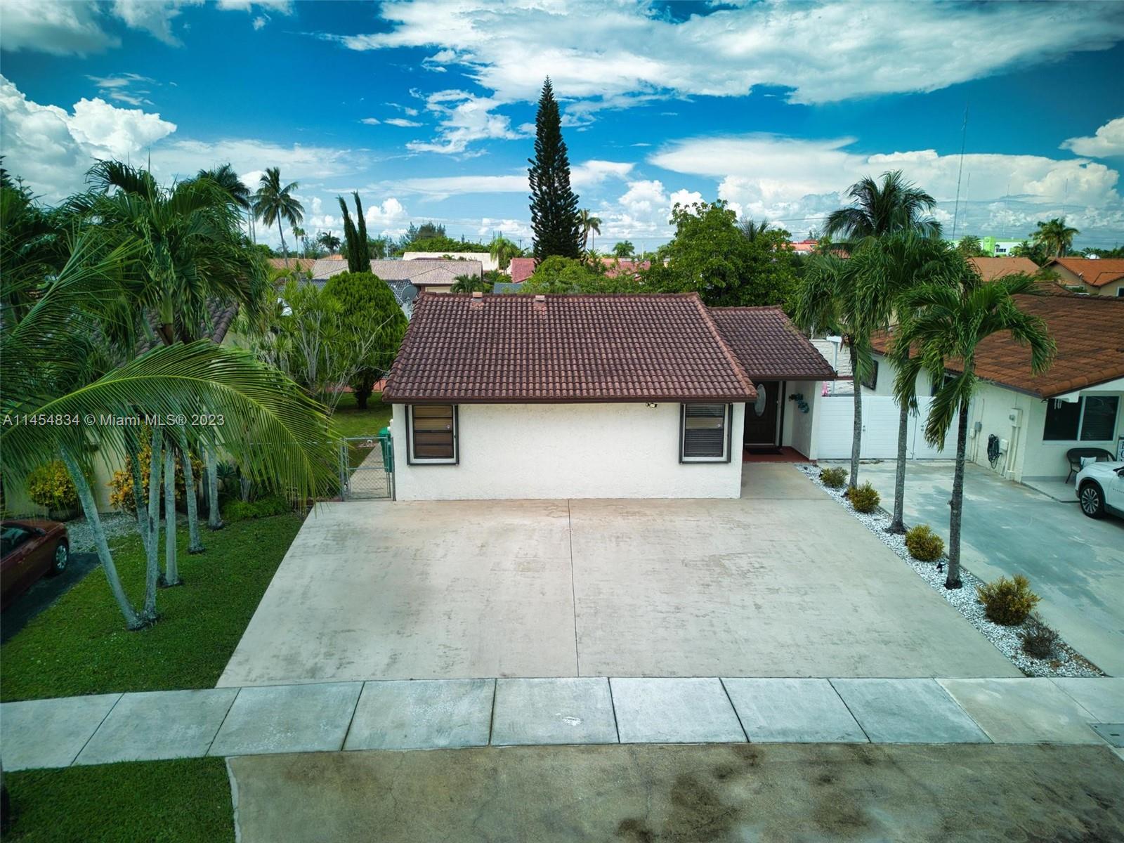 Tamiami Miami, FL 33182 - Photo 33 of 47 a aerial view of a house with a yard and potted plants
