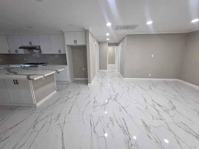 a large kitchen with cabinets